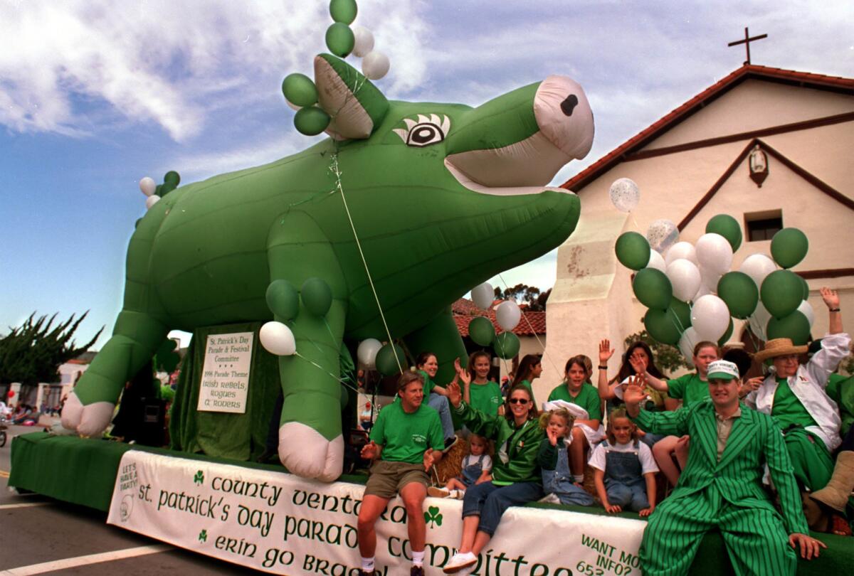 March 14, 1998: The giant green pig float Sham Hock makes its way past the San Buenaventura Mission in Ventura during the annual St. Patrick's Day parade.
