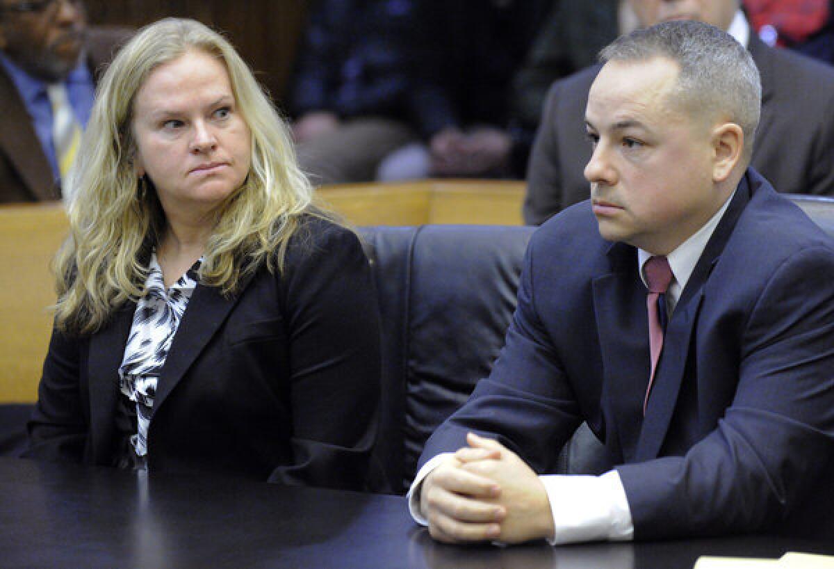 Joseph Weekley, right, attended a Detroit court hearing in March. At left is A&E producer Allison Howard, who was at the raid for the reality series "The First 48."