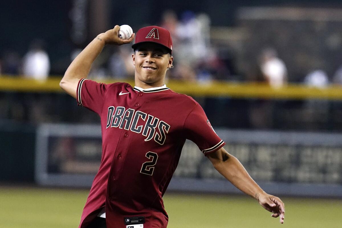 Diamondbacks first round draft pick Druw Jones throws out the first pitch prior to a game against the Nationals in July 2022.