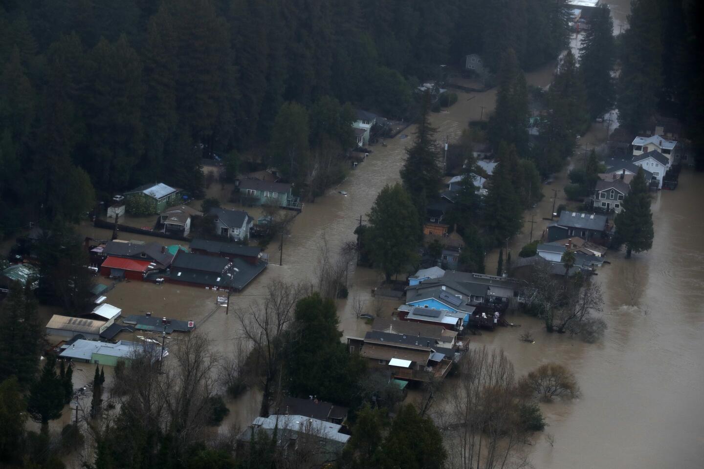 Homes and businesses are inundated by floodwaters Wednesday in Guerneville, Calif.