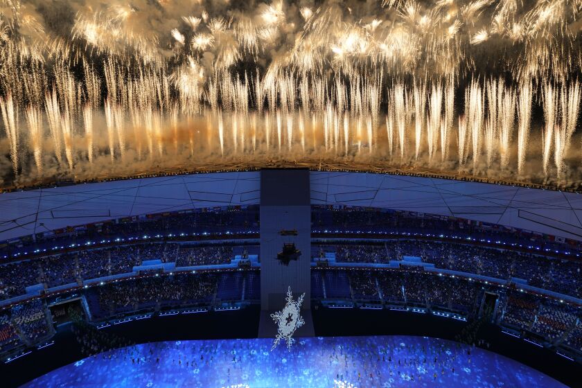 Fireworks light up the sky over Olympic Stadium during the opening ceremony of the 2022 Winter Olympics, Friday, Feb. 4, 2022, in Beijing. (AP Photo/Jeff Roberson)