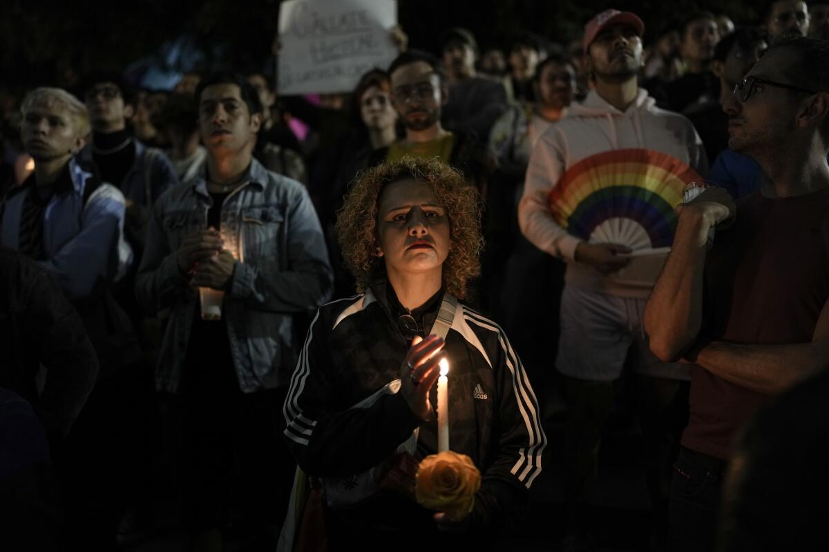 Protester holding candle in Mexico City