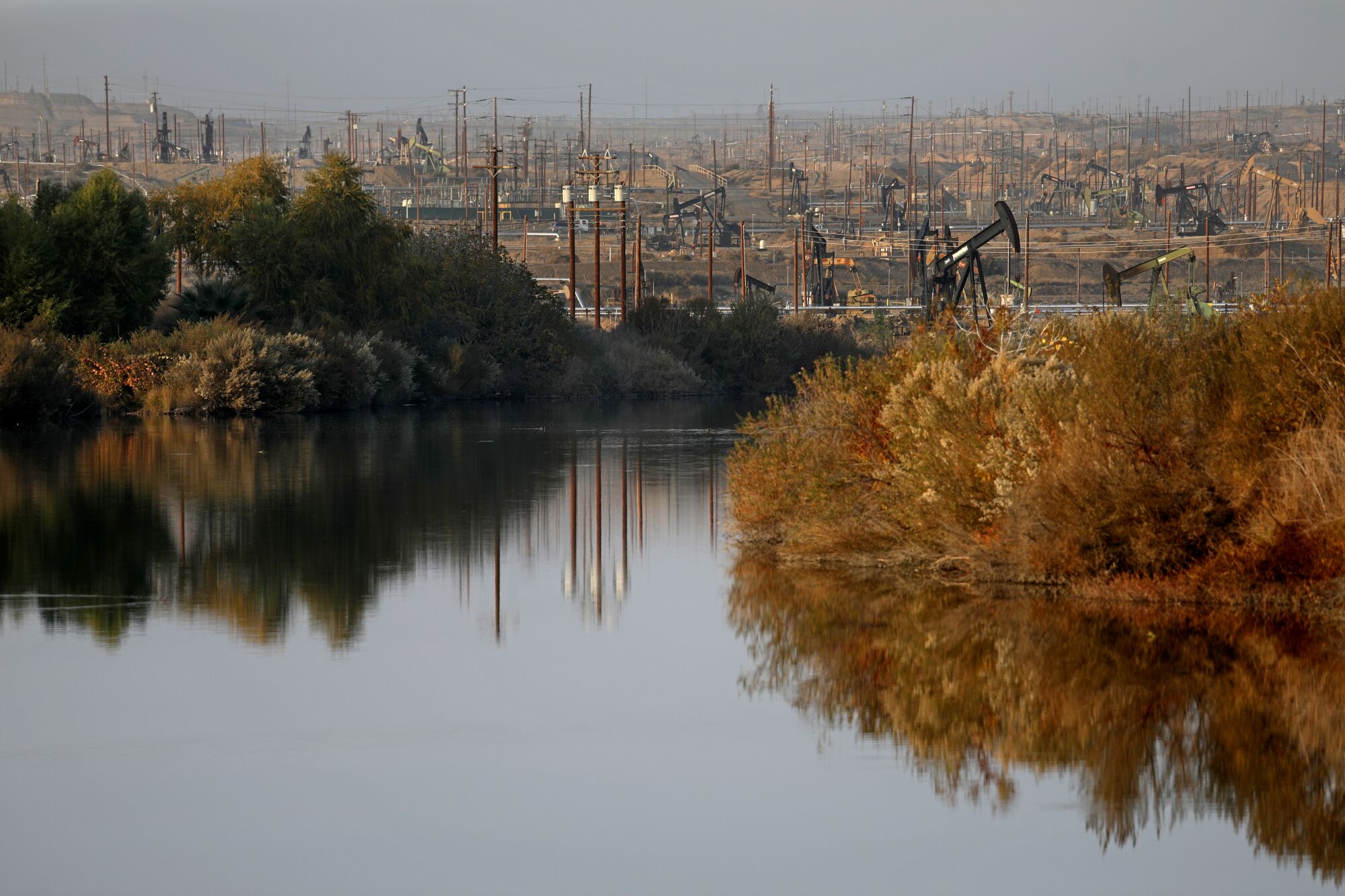 Pumpjacks in the Kern River Oil Field can be seen in the background from the Rocky Point weir
