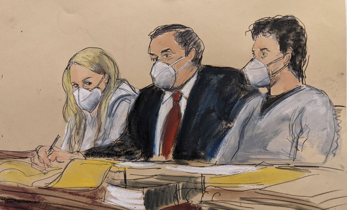 In this courtroom sketch, attorney Sam Enzer, center, sits between Heather Morgan, left, and her husband, Ilya "Dutch" Lichtenstein, in federal court, Tuesday, Feb. 8, 2022, in New York. The couple are accused of conspiring to launder billions of dollars in cryptocurrency stolen from the 2016 hack of a virtual currency exchange. (AP Photo/Elizabeth Williams)
