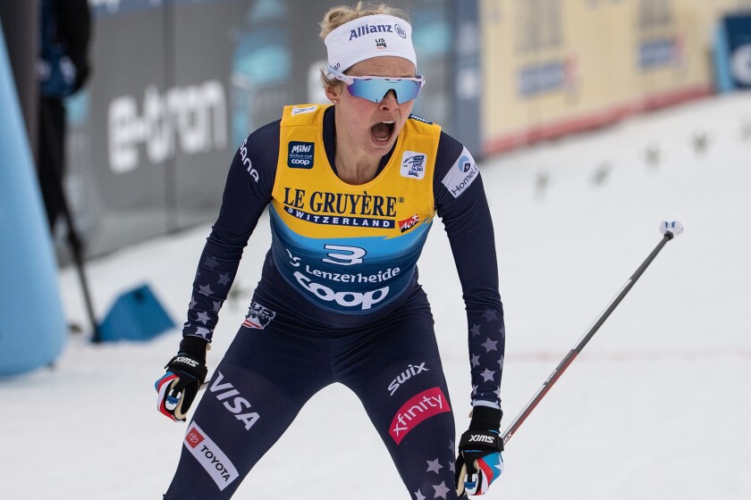 FILE - United States' Jessie Diggins celebrates winning a cross-country ski sprint event at the FIS Tour de Ski in Lenzerheide, Switzerland, Tuesday, Dec. 28, 2021. Diggins literally wrote the book on the struggles female athletes face as they try to stay fit while dealing with unrealistic pressures to have a certain body type. (Peter Schneider/Keystone via AP, File)