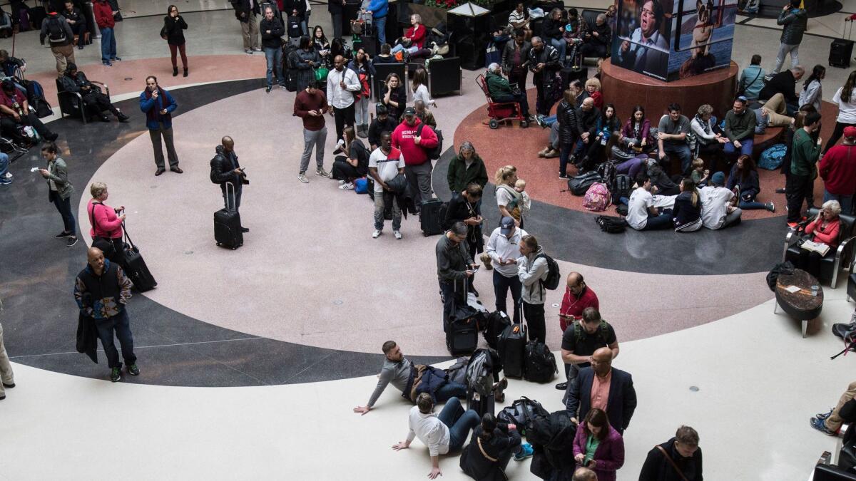 Long lines form at Hartsfield-Jackson International Airport after a power outage on Sunday, Dec. 17, 2017, grounded scores of flights and passengers.