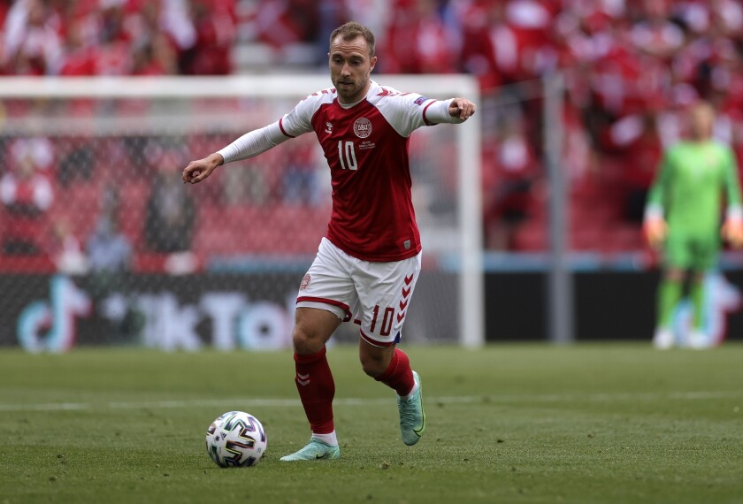 FILE - Denmark's Christian Eriksen controls the ball during the Euro 2020 soccer championship group B match between Denmark and Finland at Parken stadium in Copenhagen, June 12, 2021. Eriksen has resumed training in Denmark as part of his rehabilitation after suffering a cardiac arrest at the European Championship. The 29-year-old midfielder is using a field at Odense Boldklub, the club where he started his career before playing for Ajax, Tottenham and most recently Inter Milan before collapsing while playing for Denmark in June. (Wolfgang Rattay/Pool via AP, file)