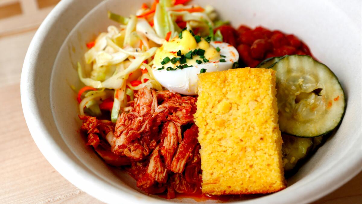 The barbecue picnic salad from Everytable comes with barbecue chicken salad, baked beans, coleslaw, whole wheat corn bread, bread-and-butter pickles and a deviled egg, for $3.95 in South L.A.