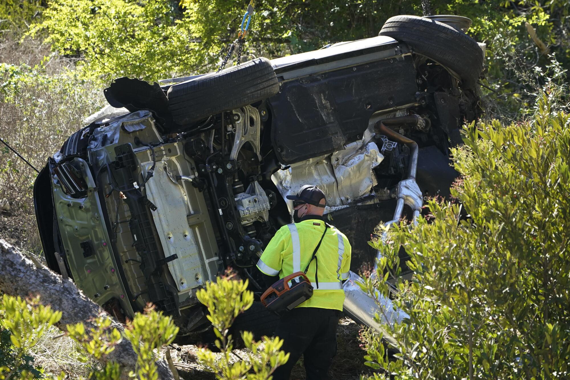 The vehicle rests on its side after a rollover accident involving golfer Tiger Woods in Rancho Palos Verdes.
