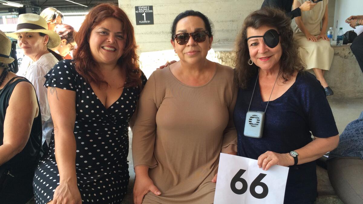 Painter Sandy Rodriguez, left, photographer Isabel Castro and multimedia artist Barbara Carrasco came out to participate in the group portrait.