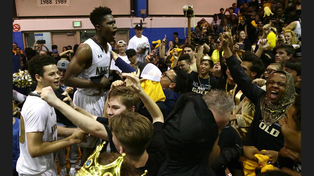 Bishop Montgomery guard David Singleton celebrates with fans after leading his team to an 87-80 win over Chino Hills in a Southern California Open Division Regional semifinal at El Camino College last season.