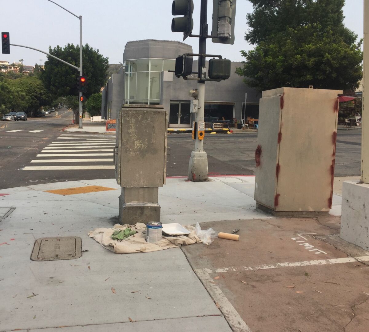 Utility boxes at Pearl Street and Girard Avenue are shown before a paint job by Enhance La Jolla.