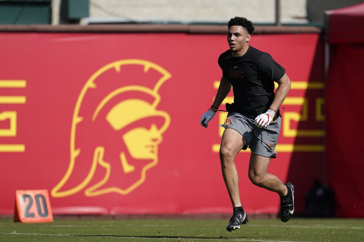 Wide receiver Drake London runs a drill in front of NFL team scouts on USC's campus Friday.