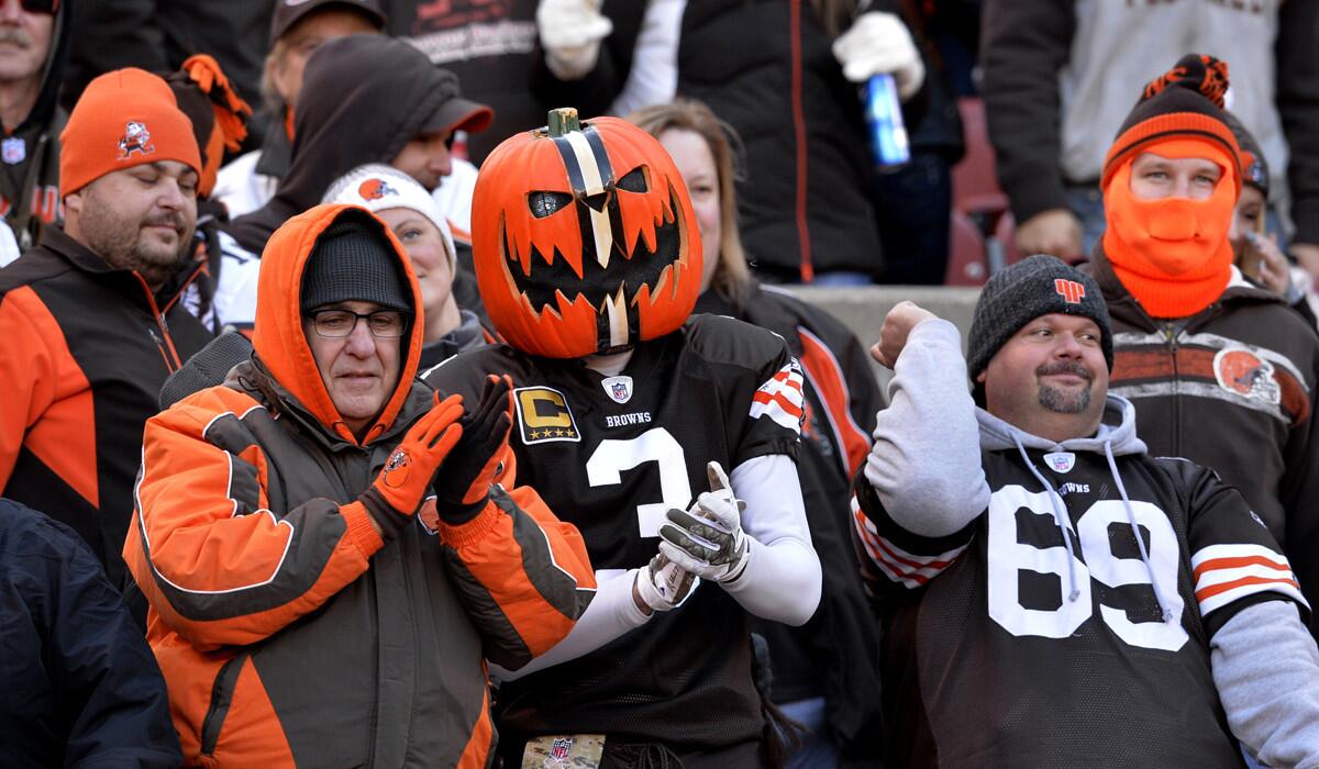 Browns fans, including Gus Angelone in the pumpkinhead, cheer on Cleveland in a 22-17 victory over the Tampa Bay Buccaneers on Nov. 2.