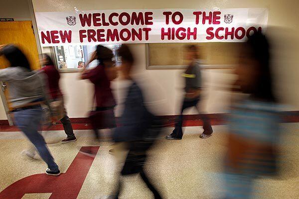 Signs and banners welcome students at Fremont High as the school reopened with a largely new staff and a program makeover. It's the first Los Angeles Unified high school to be reconstituted because of poor academic performance. The teachers union and school staff contend that teachers were scapegoated for problems that were outside of their control. See full story