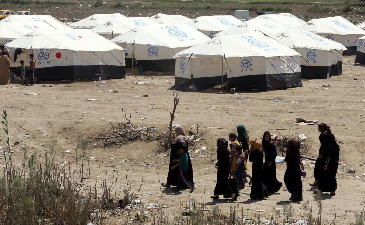 Displaced Sunni Iraqis who fled the violence in the Iraqi city of Ramadi arrive at a makeshift camp on the outskirts of Baghdad on Sunday.