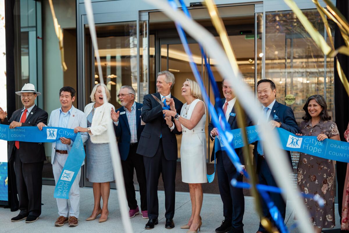 Local dignitaries and officials from City of Hope O.C. cut a ribbon.