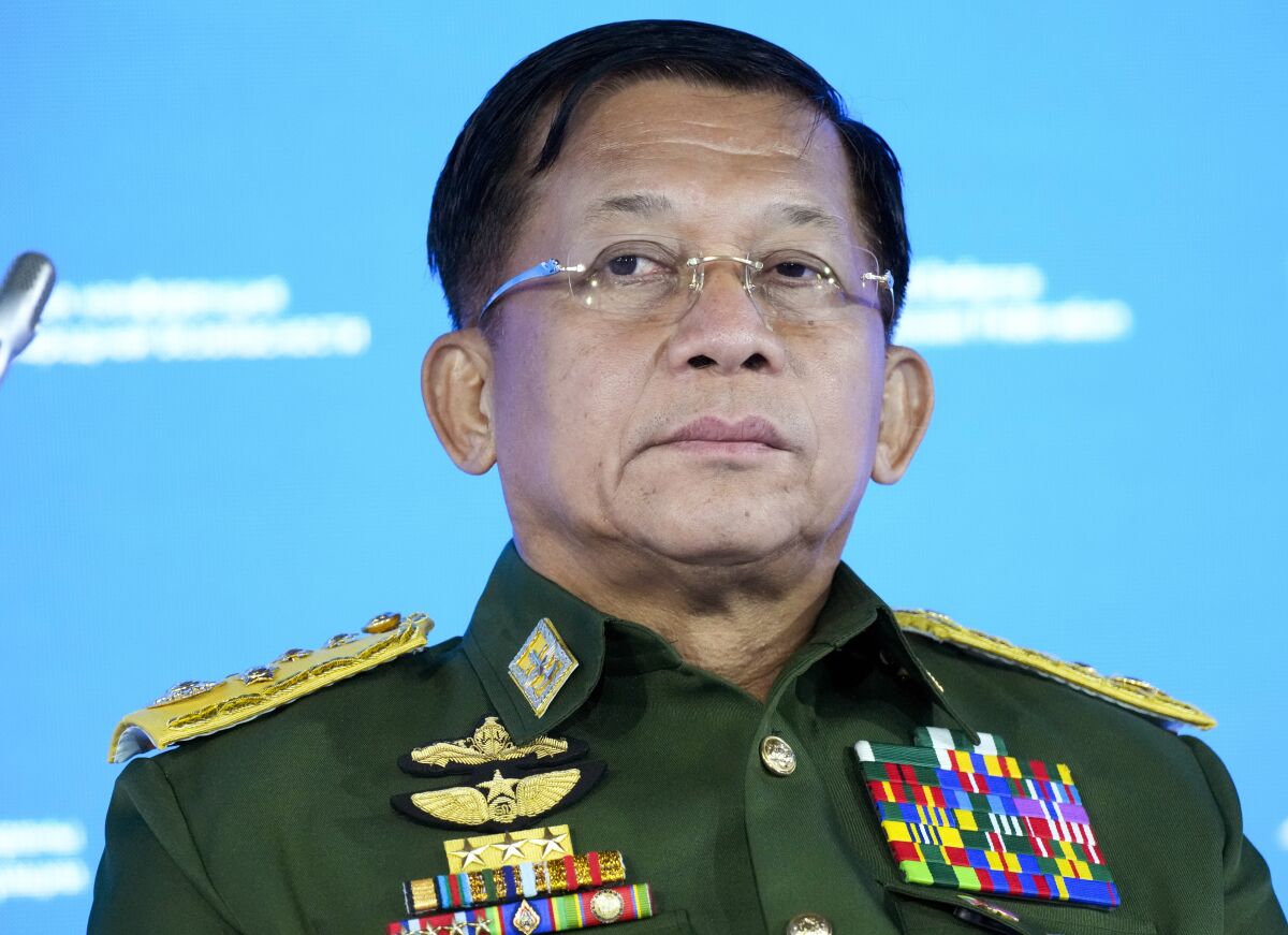 FILE - In this June 23, 2021, file photo, Commander-in-Chief of Myanmar's armed forces, Senior General Min Aung Hlaing delivers his speech at the IX Moscow conference on international security in Moscow, Russia. Min Aung Hlaing said Monday, Oct. 18, 2021, that fellow members of a regional grouping of Southeast Asian countries should share responsibility for failing to help quell the violence that has engulfed his nation since the army seized power in February. (AP Photo/Alexander Zemlianichenko, Pool)