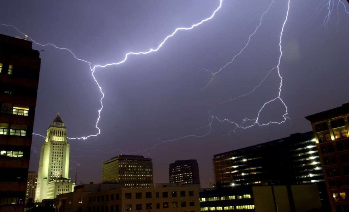Lightning streaks across the sky in downtown Los Angeles. Could solar wind have had anything to do with it?