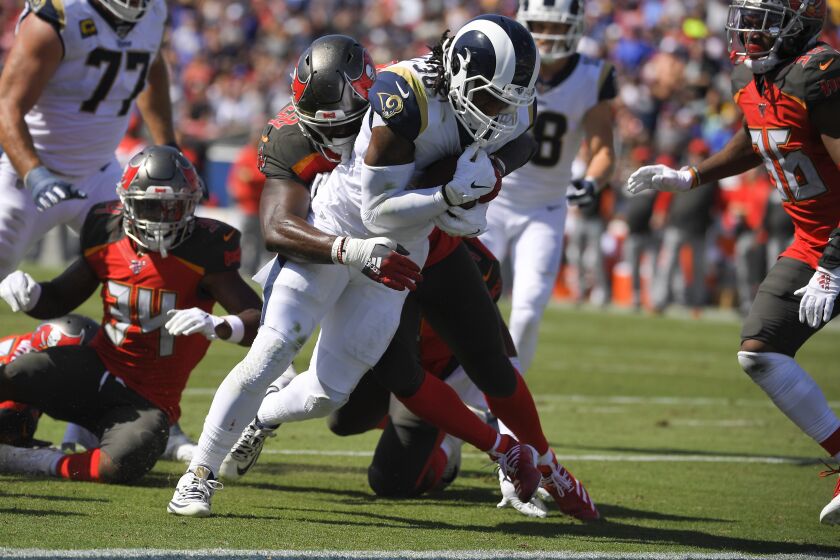 Los Angeles Rams running back Todd Gurley scores past the Tampa Bay Buccaneers during the first of an NFL football game Sunday, Sept. 29, 2019, in Los Angeles. (AP Photo/Mark J. Terrill)