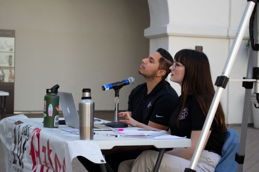 Daily Aztec Editor Bella Ross and David Santillan covering a debate at The Student Union in March, 2019.