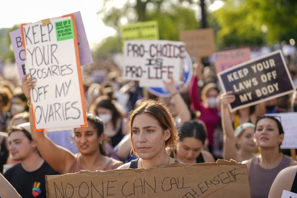 A crowd gathers outside the Supreme Court on Tuesday after a purported leak that Roe vs. Wade would be overturned.