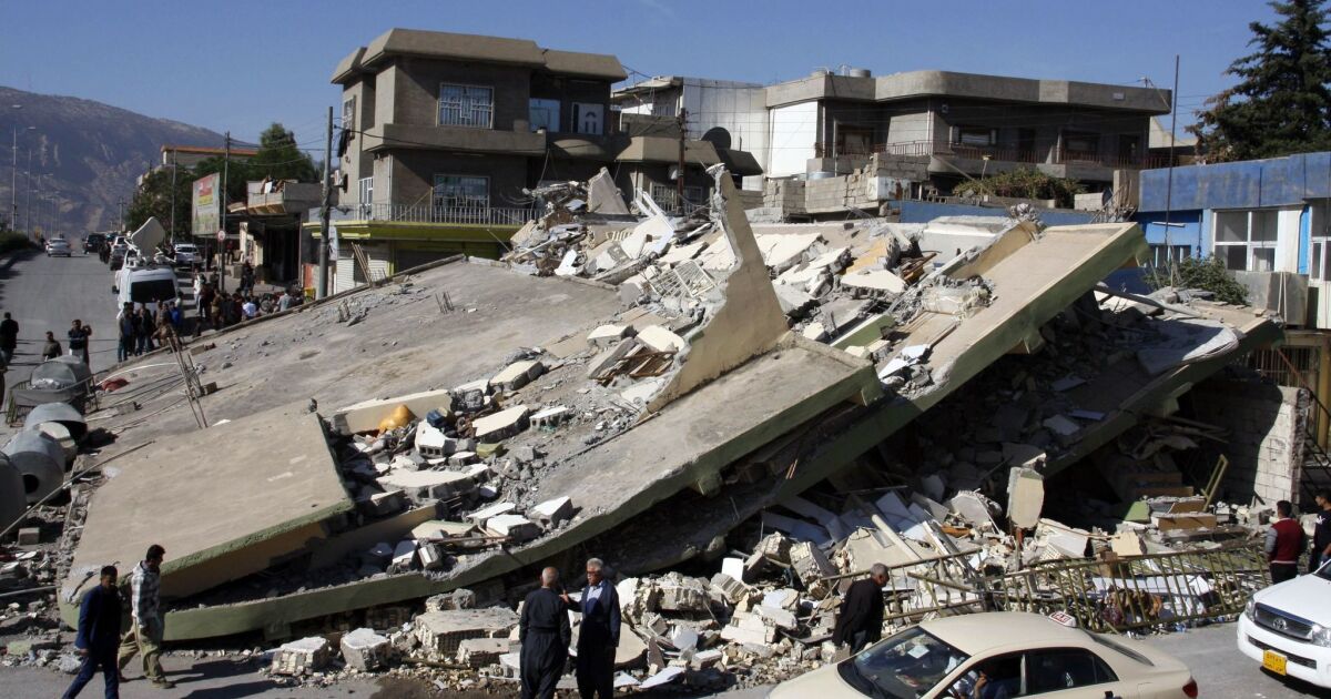 In Iraq, crashing boulders, collapsed homes and a town on edge after