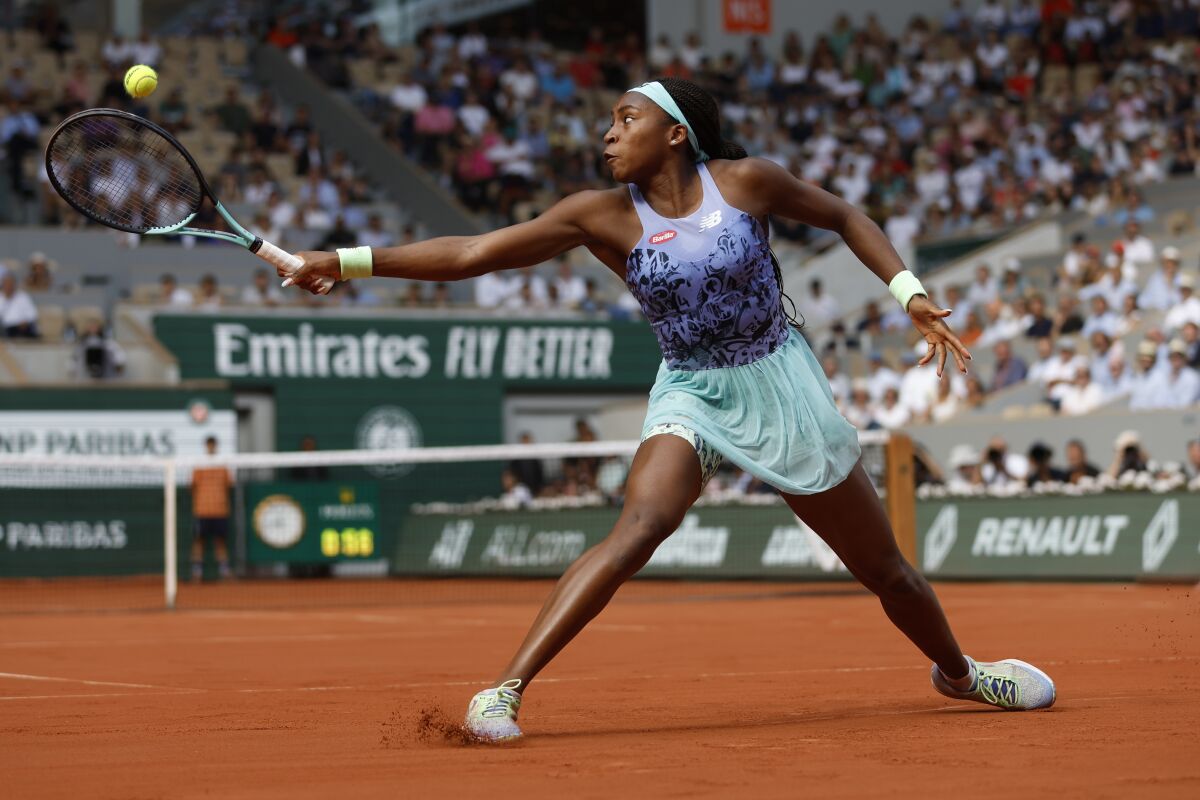 Coco Gauff of the U.S.returns the ball to Italy's Martina Trevisan during their semifinal match of the French Open tennis tournament at the Roland Garros stadium Thursday, June 2, 2022 in Paris. (AP Photo/Jean-Francois Badias)