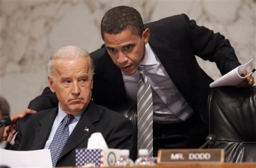 A Jan. 31, 2007 file photo shows then Sen. Barack Obama, D-Ill., right, huddling with Senate Foreign Relations Committee Chairman Sen. Joseph Biden, D-Del., left, on Capitol Hill in Washington. On Sunday, Nov. 16, 2008, President-elect Barack Obama will resign from the Senate, which served as the launching pad for a rocket that, against the odds, carried Obama to the White House. (AP Photo/Susan Walsh, File)