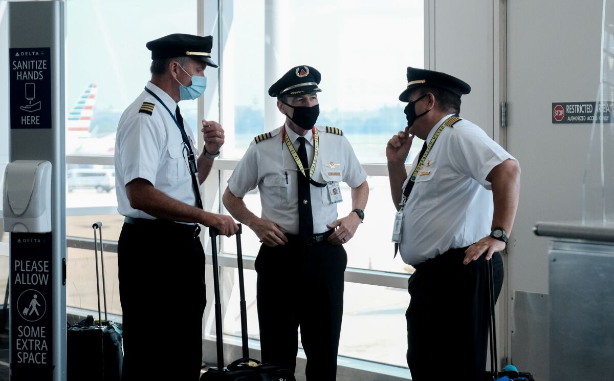 Pilots talking after exiting a Delta Airlines flight at the Ronald Reagan National Airport.