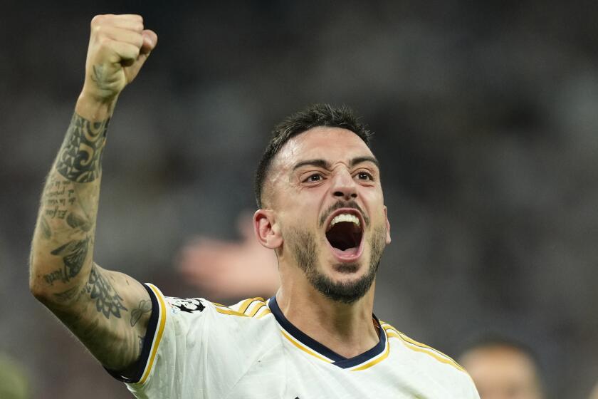 Real Madrid's Joselu celebrates after winning the Champions League semifinal second leg soccer match between Real Madrid and Bayern Munich at the Santiago Bernabeu stadium in Madrid, Spain, Wednesday, May 8, 2024. Real Madrid won 2-1. (AP Photo/Jose Breton)