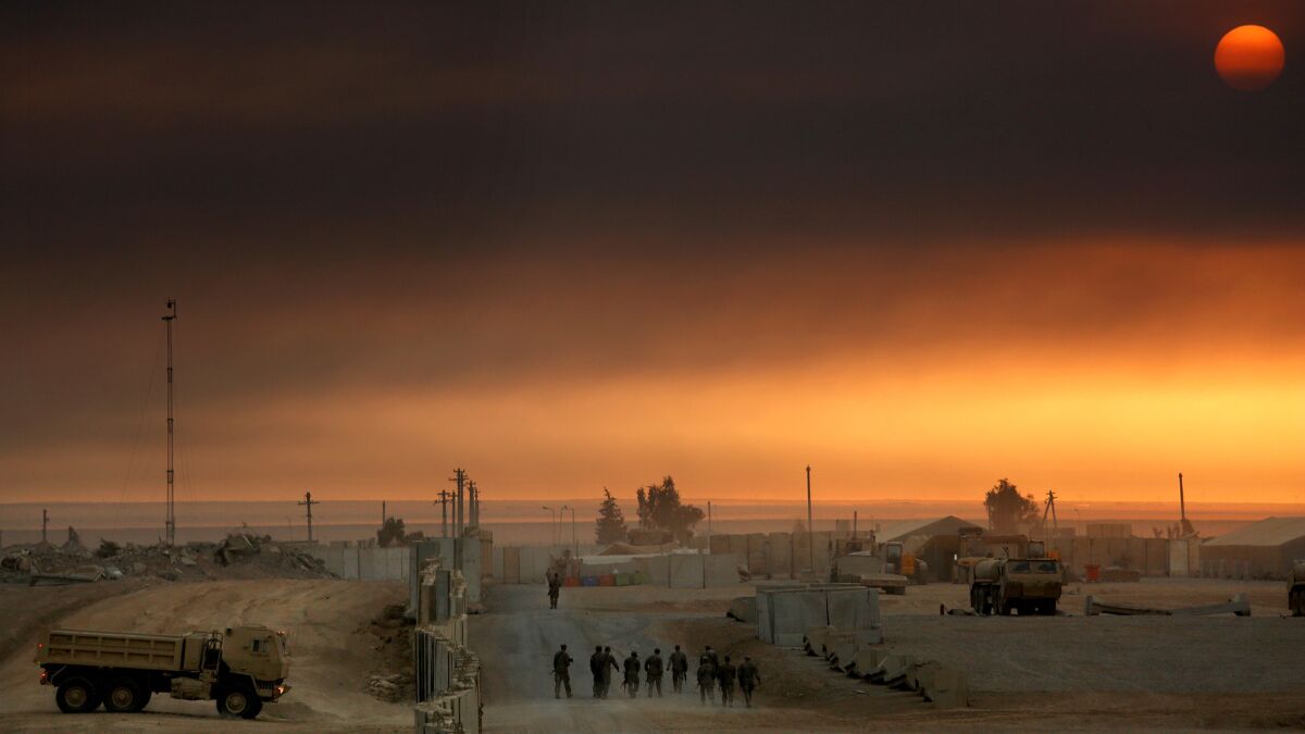 The sun sets over coalition forces are working working with Iraqi troops at Qayyarah Airfield West.