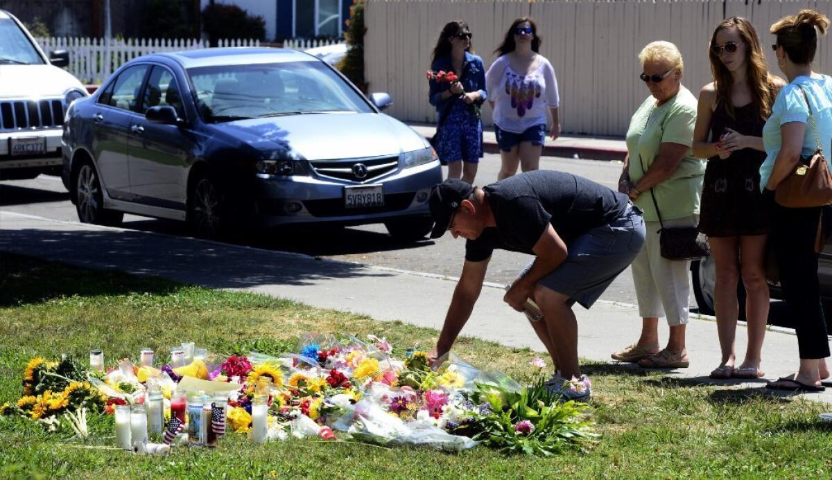 People pay their respects at the Alpha Phi sorority in Isla Vista, where two young women were killed in Friday's rampage.