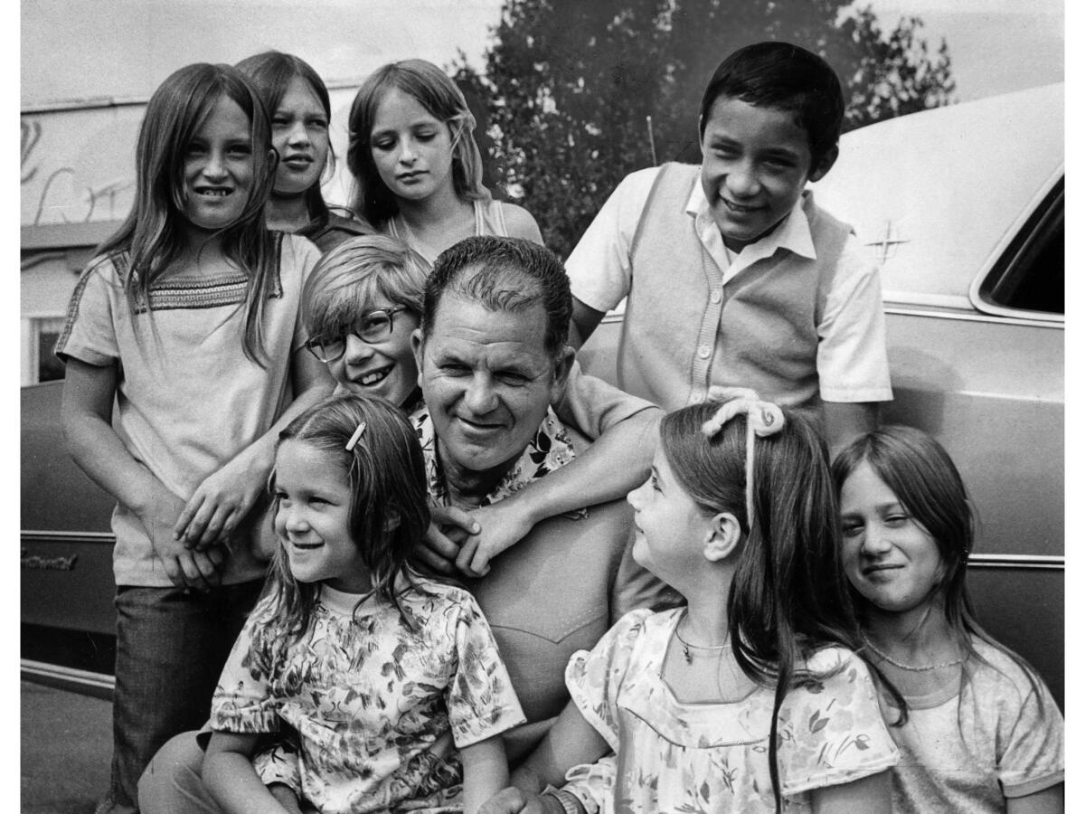 Aug. 22, 1976: Bus driver Ed Ray is surrounded by some of the children he is credited with rescuing as Chowchilla celebrates "Ed Ray and Children Day," with parade, speeches and barbecue.