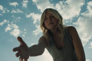 A young woman offers her hand in the movie "The Aviary."