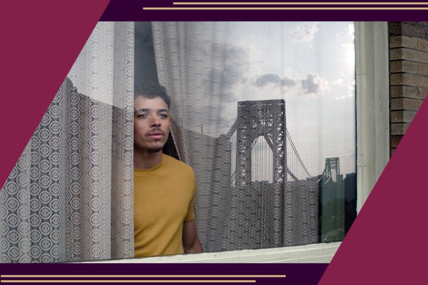 Anthony Ramos looks out a window.