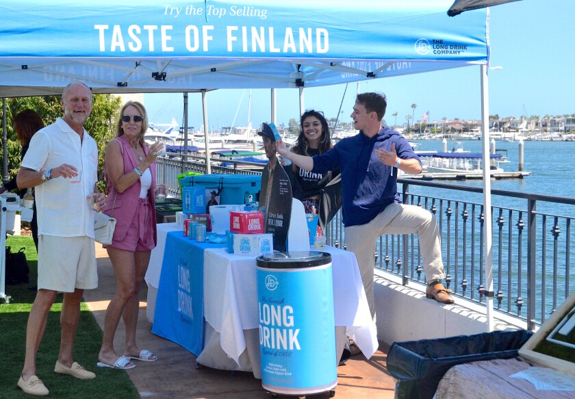Wes and Kathy Iseley sample the Finnish Long drink during Sunday's Newport Beach Wine & Spirits Festival.