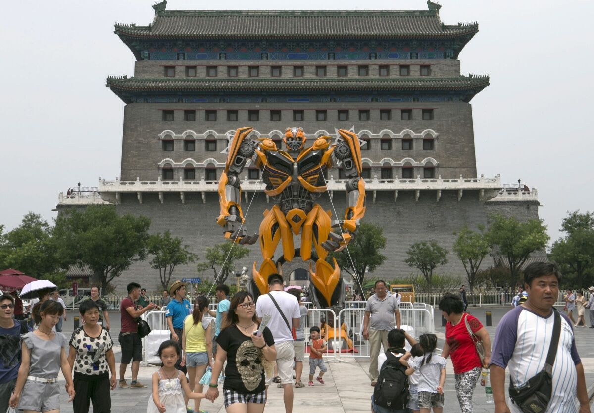 A replica of the Transformer character Bumblebee is displayed near the Qianmen district in Beijing on June 24.