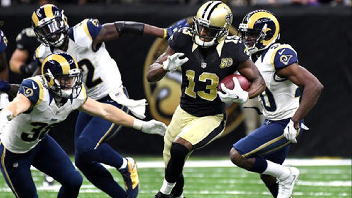 Saints receiver Michael Thomas takes off for a big gain after making one of his nine receptions against the Rams.