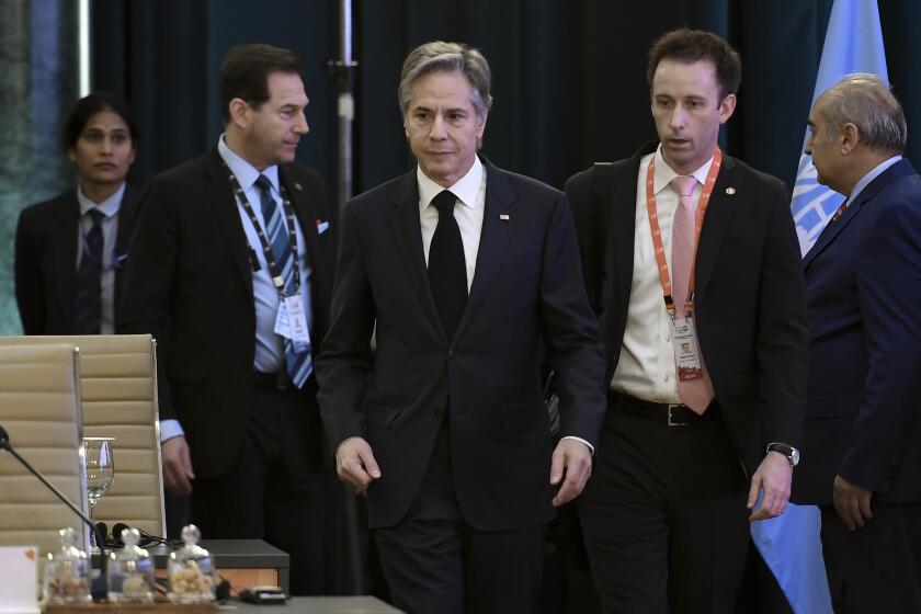 U.S. Secretary of State Antony Blinken, center, attends the G20 foreign ministers' meeting in New Delhi Thursday, March 2, 2023. (Olivier Douliery/Pool Photo via AP)
