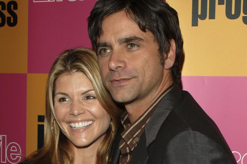 "Full House" stars Lori Laughlin and John Stamos attend the "Jake In Progress" season premiere party on Jan. 9, 2006.