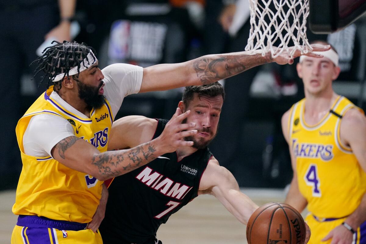 Lakers forward Anthony Davis tries to block a shot by Heat guard Goran Dragic during the first half of Game 1.