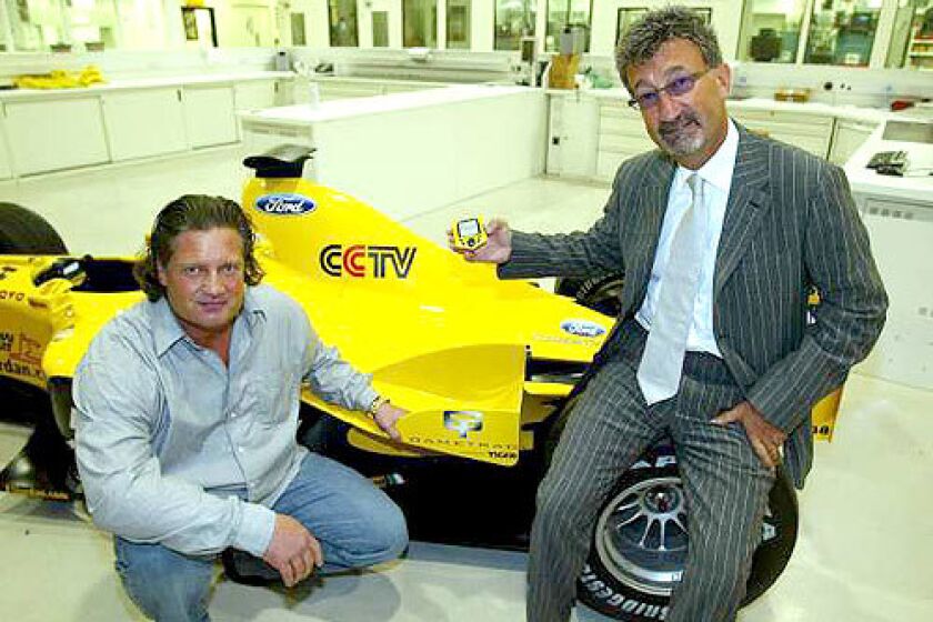 THE GOOD LIFE: Bo Stefan Eriksson, on trial after a Feb. 21 crash in Malibu, poses with a racing car at the British Grand Prix in 2003.