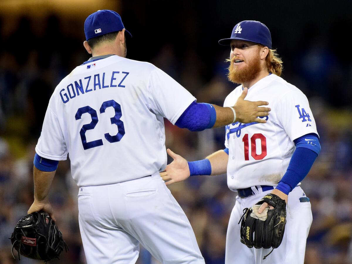 Dodgers infielder Adrian Gonzalez and Justin Turner, celebrating a win earlier this month here, both missed Sunday's game with injuries.