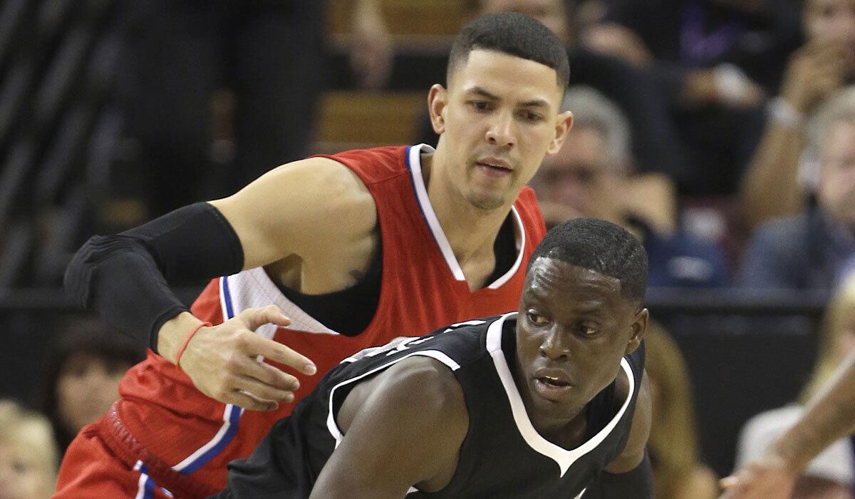 Austin Rivers, top, defends Sacramento guard Darren Collison on Wednesday night.