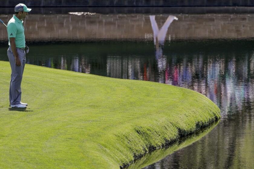 Sergio Garcia, of Spain, looks over the water on the 15th hole during the first round at the Masters golf tournament Thursday, April 5, 2018, in Augusta, Ga. Garcia shot an 8-over 13 on the hole. (AP Photo/David J. Phillip)