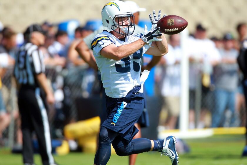 Chargers running back Danny Woodhead runs and catches on the field at Chargers Park on the first day of camp.
