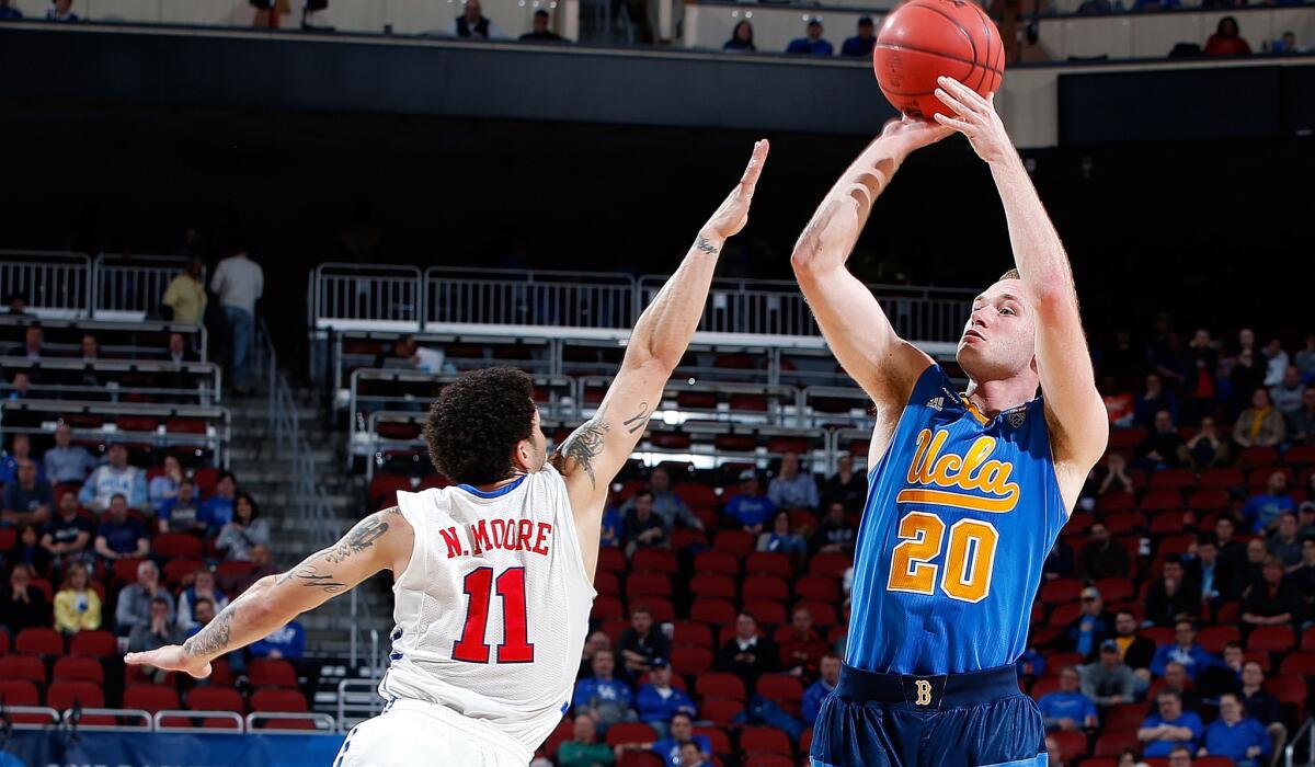 UCLA guard Bryce Alford shoots a three-pointer over Southern Methodist guard Nick Moore late in the game Thursday night.