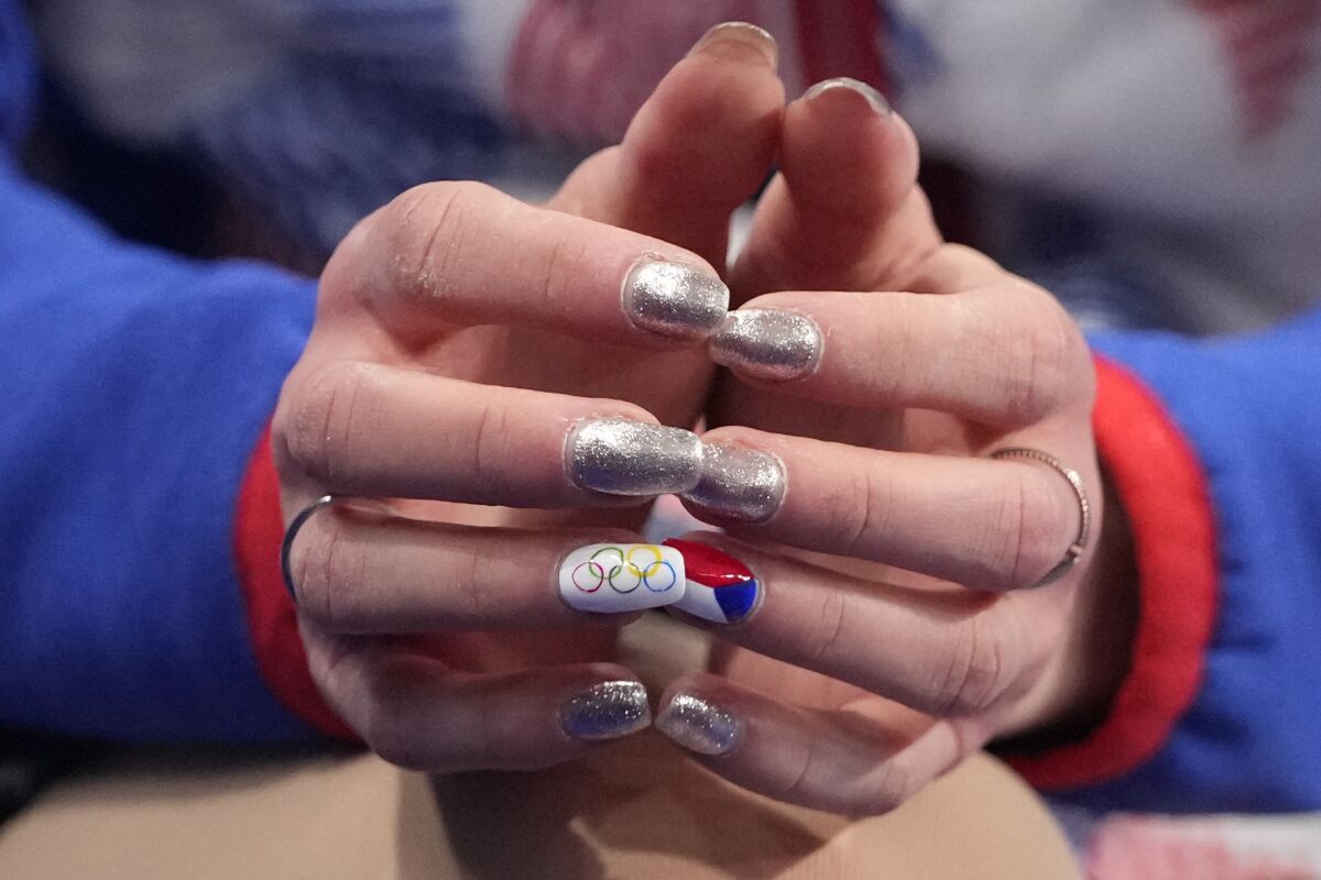 Eliska Brezinova, of the Czech Republic, finger nails are seen after the women's short program during the figure skating at the 2022 Winter Olympics, Tuesday, Feb. 15, 2022, in Beijing. (AP Photo/Natacha Pisarenko)