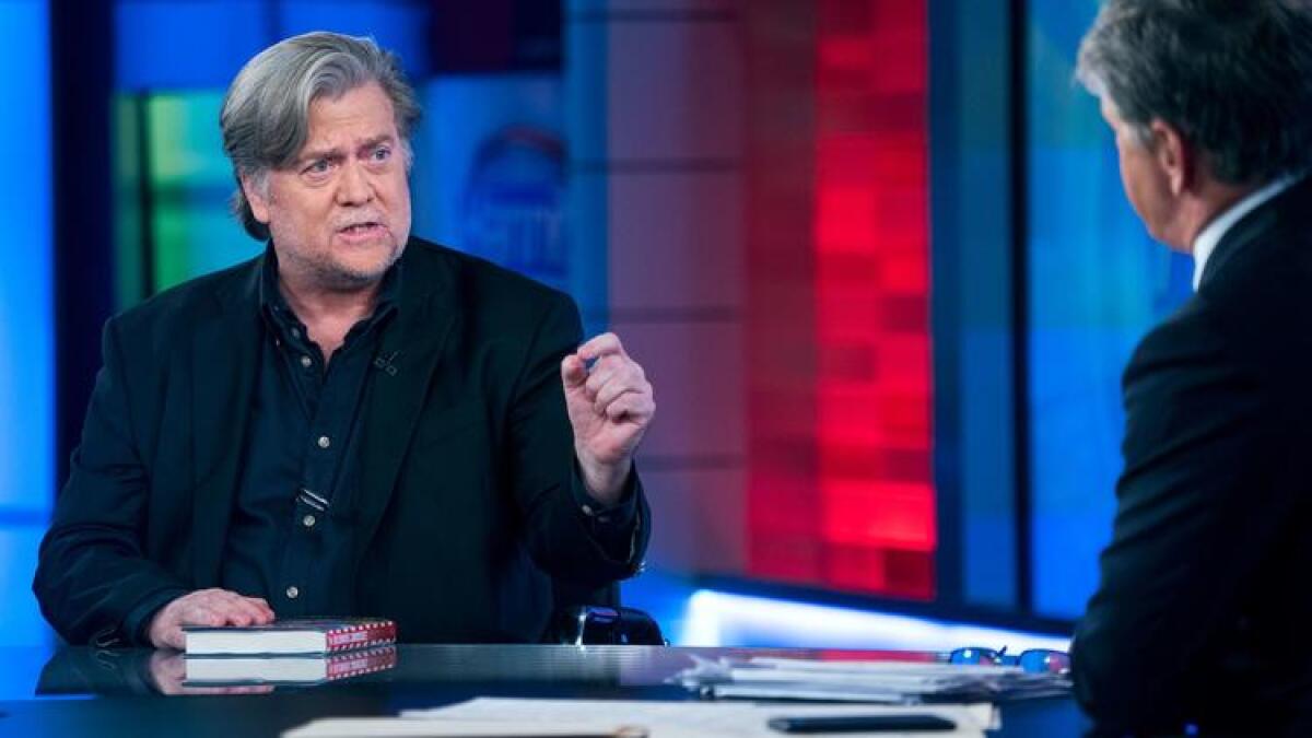 Former White House strategist Stephen K. Bannon takes part in an interview with Sean Hannity of Fox News.